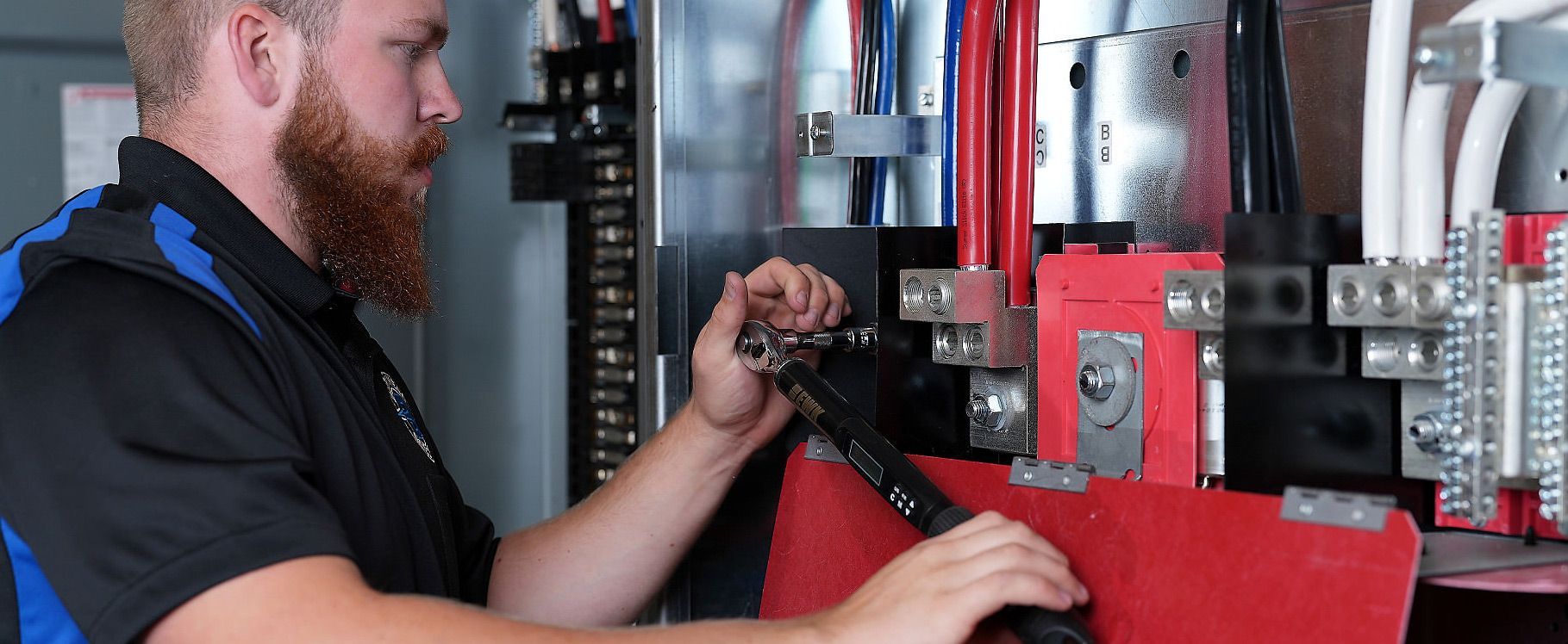 Burkhead Electric electrician working on an electrical panel